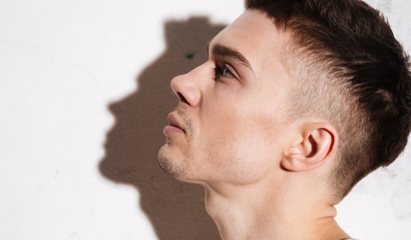 handsome man standing on floor posing