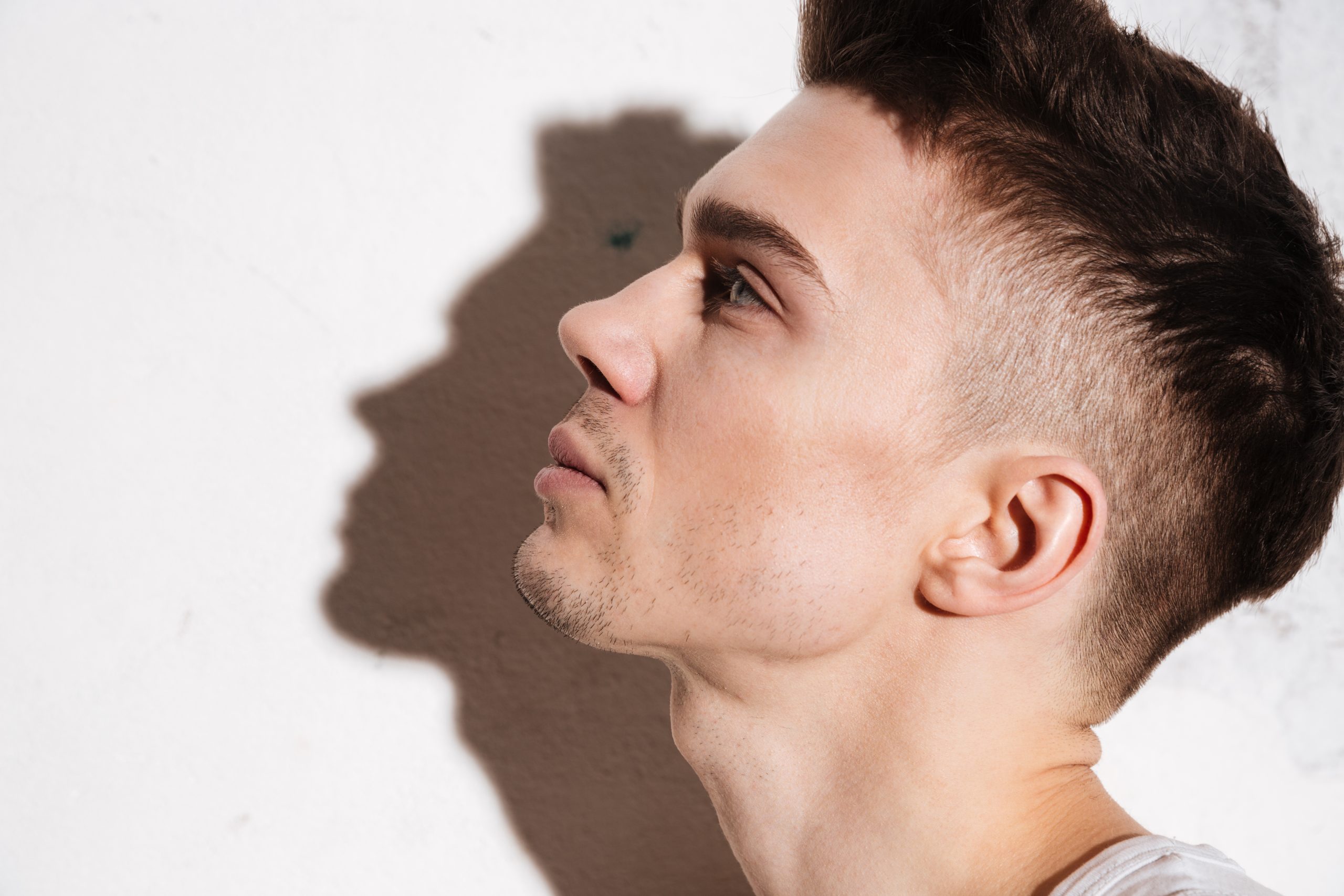 handsome man standing on floor posing